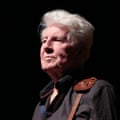 Graham Nash in a black shirt on stage