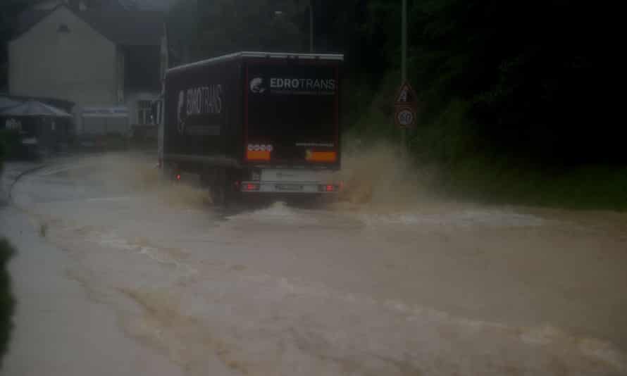 A truck drives through a flooded street in Hagen, western Germany.
