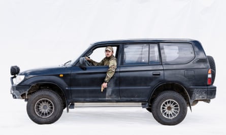 Special forces lieutenant Maksym returning to Lviv, Ukraine, from the frontline in his black Toyota 4x4