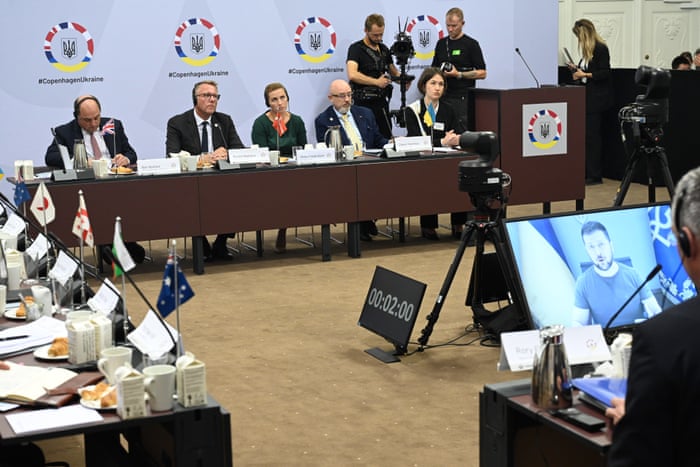 Ukraine’s president Volodymyr Zelenskiy is seen on screen as Denmark, Britain and Ukraine host an international donors conference in Copenhagen.