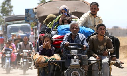 Internally displaced people from Deraa arrive near the Israeli-occupied Golan Heights.