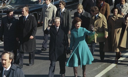 Jimmy and Rosalynn Carter walk down Pennsylvania Avenue, Washington, D.C., after being sworn in as the 39th President of the United States, January 1977.