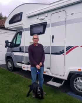 Rob Newton and his dog Baxter in front of the family’s motorhome in Tyne and Wear.