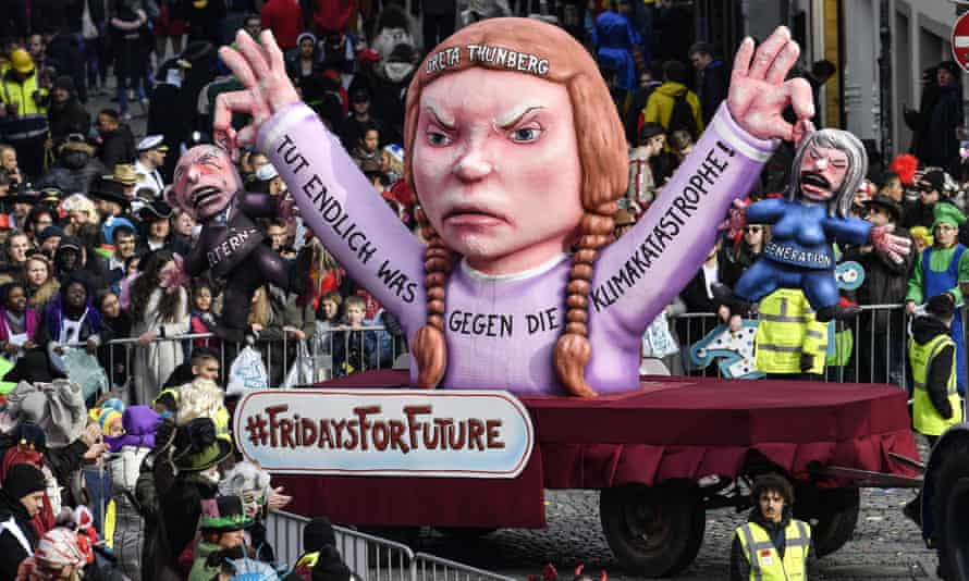 A carnival float depicts Greta Thunberg and the Friday for Future school strikes during a traditional carnival parade in Dusseldorf, Germany.