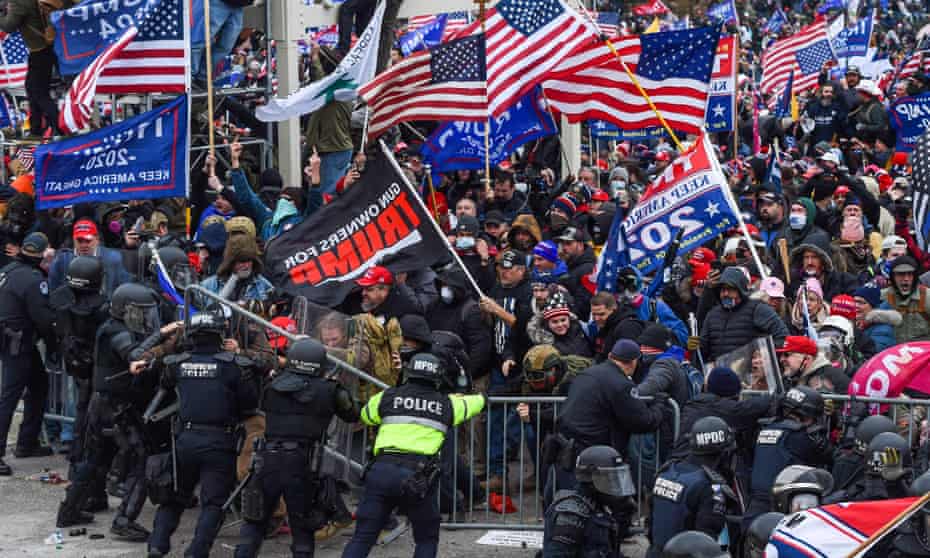 Pro-Trump mob clash with police and security forces as they storm the US Capitol in Washington DC on 6 January. 