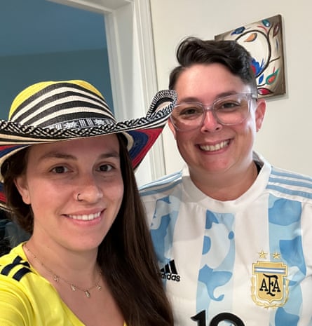 Rachel Fiegler in her Argentina shirt with her wife.