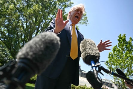 Donald Trump speaks to the press before walking to board Marine One as he departs from the White House.