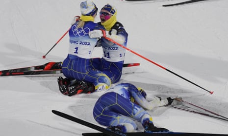 Gold medal finisher Jonna Sundling, of Sweden, left, celebrates with teammate Emma Ribom as silver medallist Maja Dahlqvist, also of Sweden, right, reacts after the women's sprint free cross-country skiing.