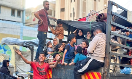 People on a truck flee the eastern parts of Rafah ahead of the threatened Israeli assault.