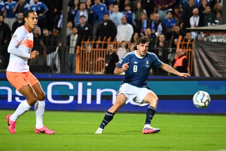Greece's Fotis Ioannidis (right) scores the opening goal as Netherlands' Virgil van Dijk looks on.