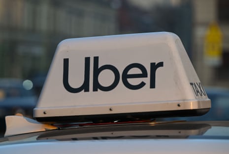 An Uber sign on top of a taxi car in Krakow, Poland, on 20 January.