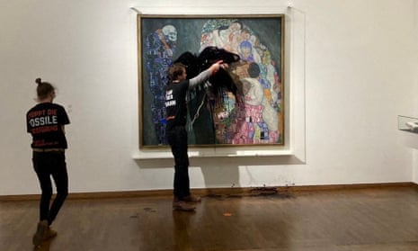 Members of Letzte Generation Österreich (Last Generation Austria) throwing black liquid at the painting Death and Life by Gustav Klimt at the Leopold Museum, Vienna, 15 November 2022.