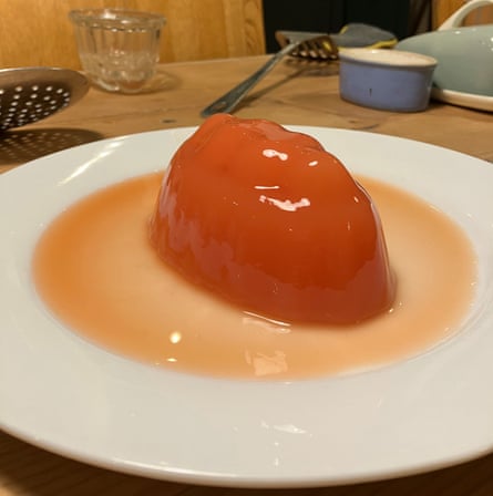 Orange blob-like jelly on a plate