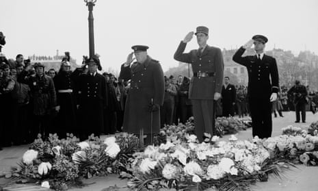 Winston Churchill (left) and Gen De Gaulle (centre) salute at the Arc de Triomphe in Paris in 1944