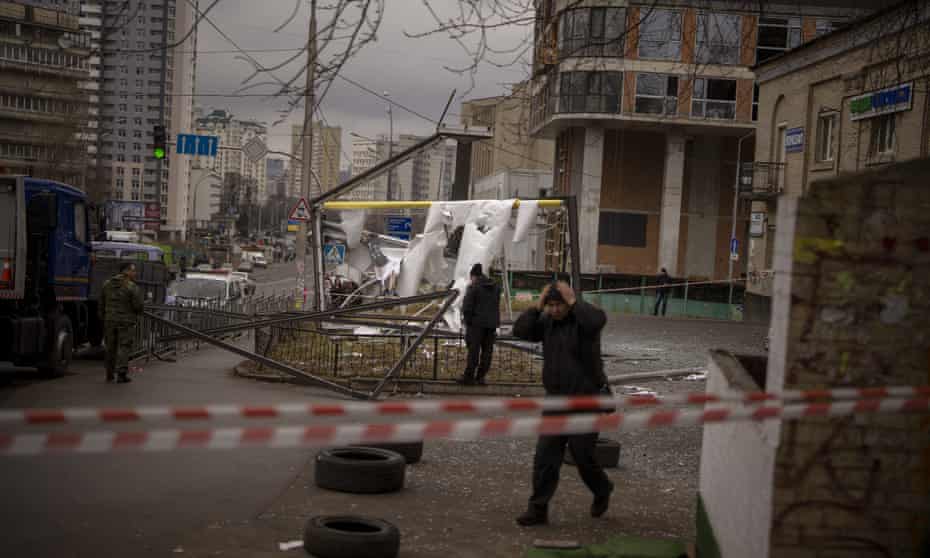 Ukrainian police inspect an area after an apparent Russian strike in Kyiv today.