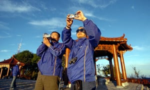 Chinese tourists taking pictures of the sunrise at Taiwan’s most famous tourist spot Alishan. Despite political tensions, Taiwan has become a popular tourist destination for Chinese since it conditionally lifted a ban on sightseeing by mainland Chinese in 2002. AFP PHOTO/Sam YEH (Photo credit should read SAM YEH/AFP/Getty Images)
