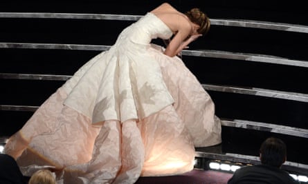 Jennifer Lawrence takes a famous tumble at the 2013 Oscars – in a Dior dress – before collecting the best actress award for Silver Linings Playbook.