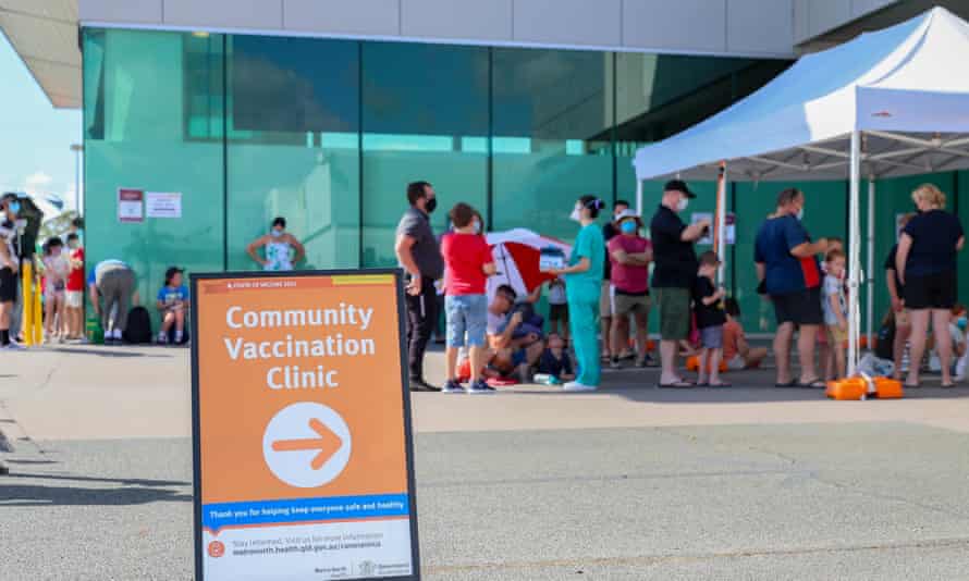 Families queue on Monday, the first day of vaccines for children, at Kippa Ring Communication Vaccination Clinic, Brisbane.