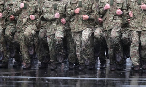 Soldiers marching in the rain at Normandy barracks, Aldershot