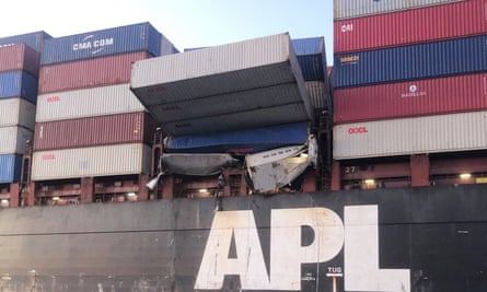 Shipping containers resting precariously on the APL England cargo ship.