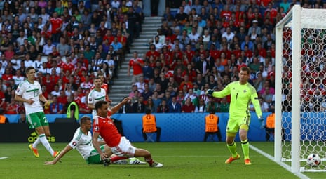 Northern Ireland’s Gareth McAuley scores a own goal and Wales first.