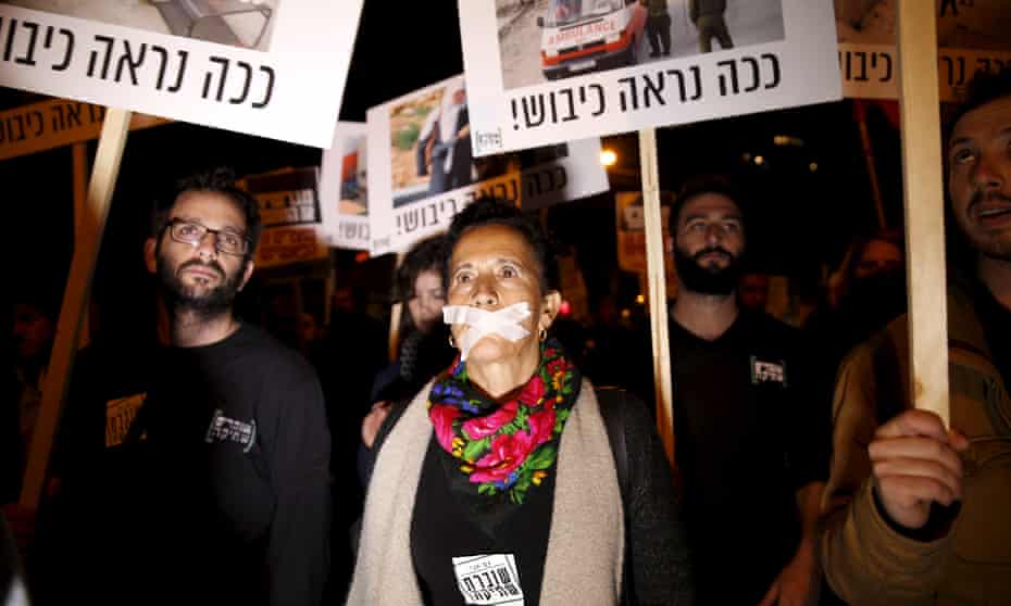 Demonstrators protest about the rightwing incitement against President Reuven Rivlin and human rights activists in Tel Aviv. 