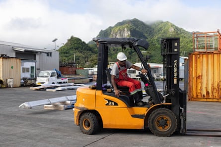 A worker operates a loading vehicle in Avatiu Harbour, Cook Islands.