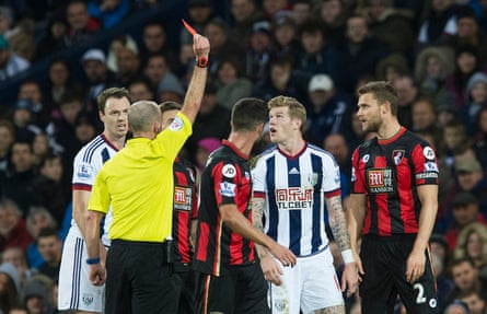 West Brom’s James McClean is sent off by referee Mike Dean
