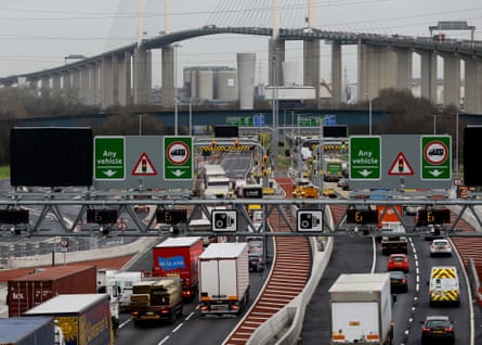 Six lanes of lorries, cars and vans all travelling in the same direction, with the large, modern Queen Elizabeth II bridge dominating the skyline beyond