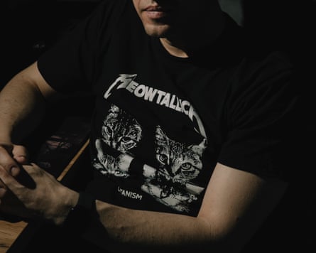 Closeup of Catman wearing a ‘Meowtallica’ T-shirt