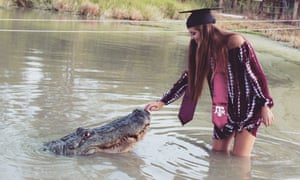 Makenzie Nolandâs graduation picture, including Big Tex the alligator