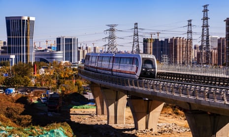 A maglev train runs on Beijing’s S1 line during a trial operation.
