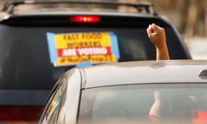Gig workers at a driving demonstration in front of Los Angeles City Hall urging voters to vote no on Proposition 22, 8 October 2020.