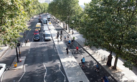 Cyclists make the morning commute along the Victoria Embankment stretch of London’s east-west cycle superhighway.