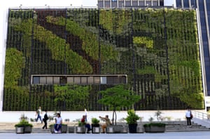 People walk in front of the Medellin City Concejo building