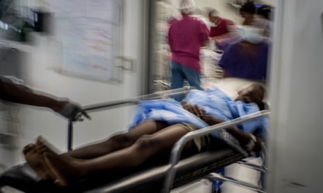 Christo Brams, 11, who was injured by a stray bullet, arrives at the Médecins Sans Frontières emergency room Port-au-Prince, Haiti, November 2022. 