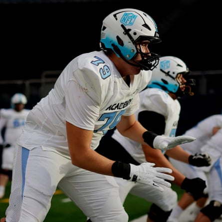 The NFL Academy offensive linemen including Max Hoke from Sweden (near) practice routines during warm up on the pitch before the match against De La Salle Spartans from California at the Tottenham Hotspur Stadium.
