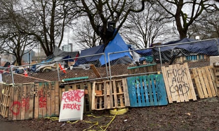 A homeless camp is completely encircled with debris and fencing to block the city of Seattle’s sweep of the camp in Cal Anderson Park in 2020.