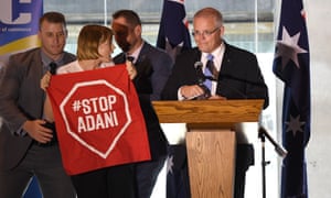 An anti-Adani protester disrupts the PM’s speech. Scott Morrison and Josh Frydenberg are playing down the remaining approvals for the coalmine.