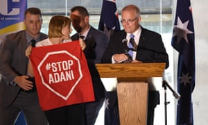 An anti-Adani protester disrupts the PM’s speech. Scott Morrison and Josh Frydenberg are playing down the remaining approvals for the coalmine. 