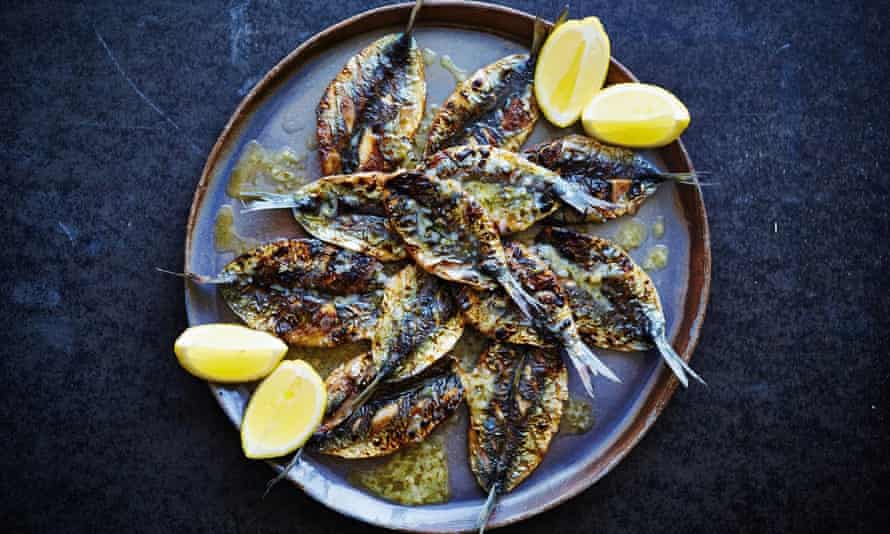 Grilled sardines with parsley, roasted garlic and lemon butter. Photo: David Loftus