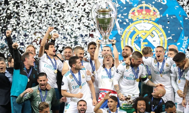 Real Madrid lift the Champions League trophy.