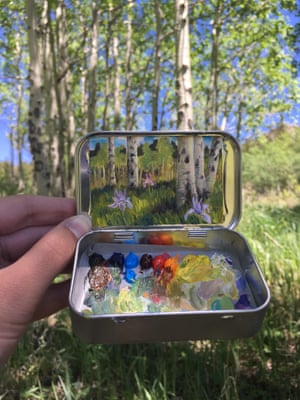 Heidi Annalise paints panoramic landscapes into small mint tins.
