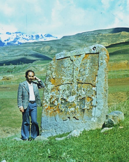 Armenian art researcher Argam Ayvazyan in 1981, next to a 14th-century khachkar in Nors, near his birthplace.