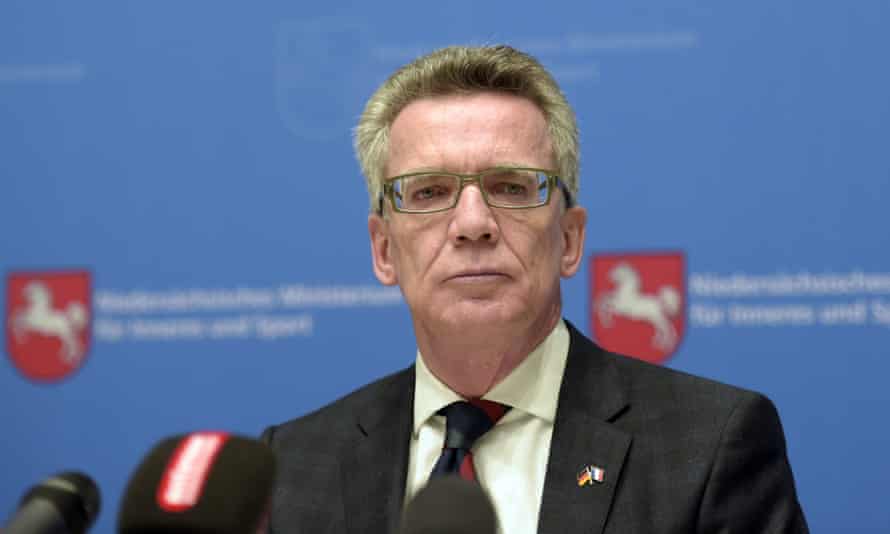 German Interior Minister Thomas de Maiziere addresses journalists at a press conference in Hanover.