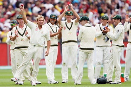 Shane Warne celebrates his 700th wicket with teammates after bowling Andrew Strauss during day one of the fourth Test at Melbourne, 2006.