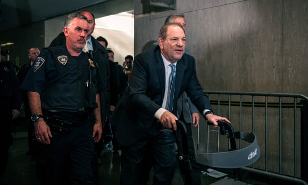 Movie producer Harvey Weinstein (R) enters New York City Criminal Court on February 24, 2020 in New York City