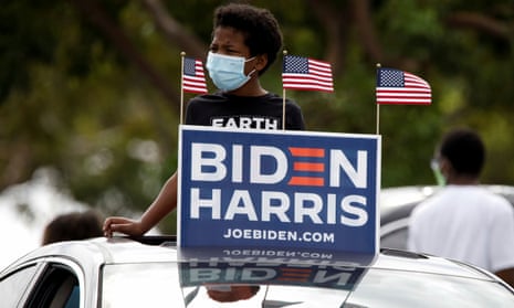 A supporter waits at a drive-in rally for former U.S. President Barack Obama in Miami<br>A supporter waits at a drive-in rally for former U.S. President Barack Obama to campaign on behalf of Democratic presidential nominee and his former Vice President Joe Biden in Miami, Florida, U.S., October 24, 2020. REUTERS/Marco Bello
