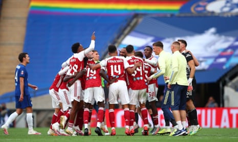 Arsenal players celebrate following their team’s victory in the FA Cup Final.