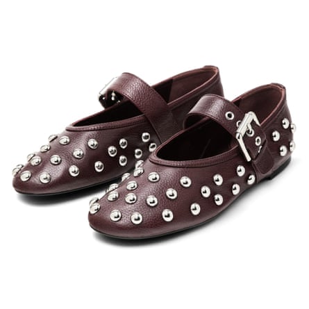 A pair of burgundy and metal-studded Massimo Dutti Ballet flats with studded buckles on a white background